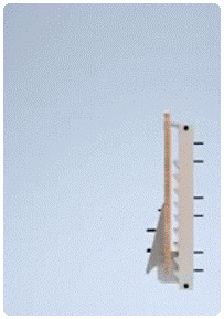 A looping CAD animation of the workstation folding down from its stowed vertical position against the channel to a deployed horizontal work surface.